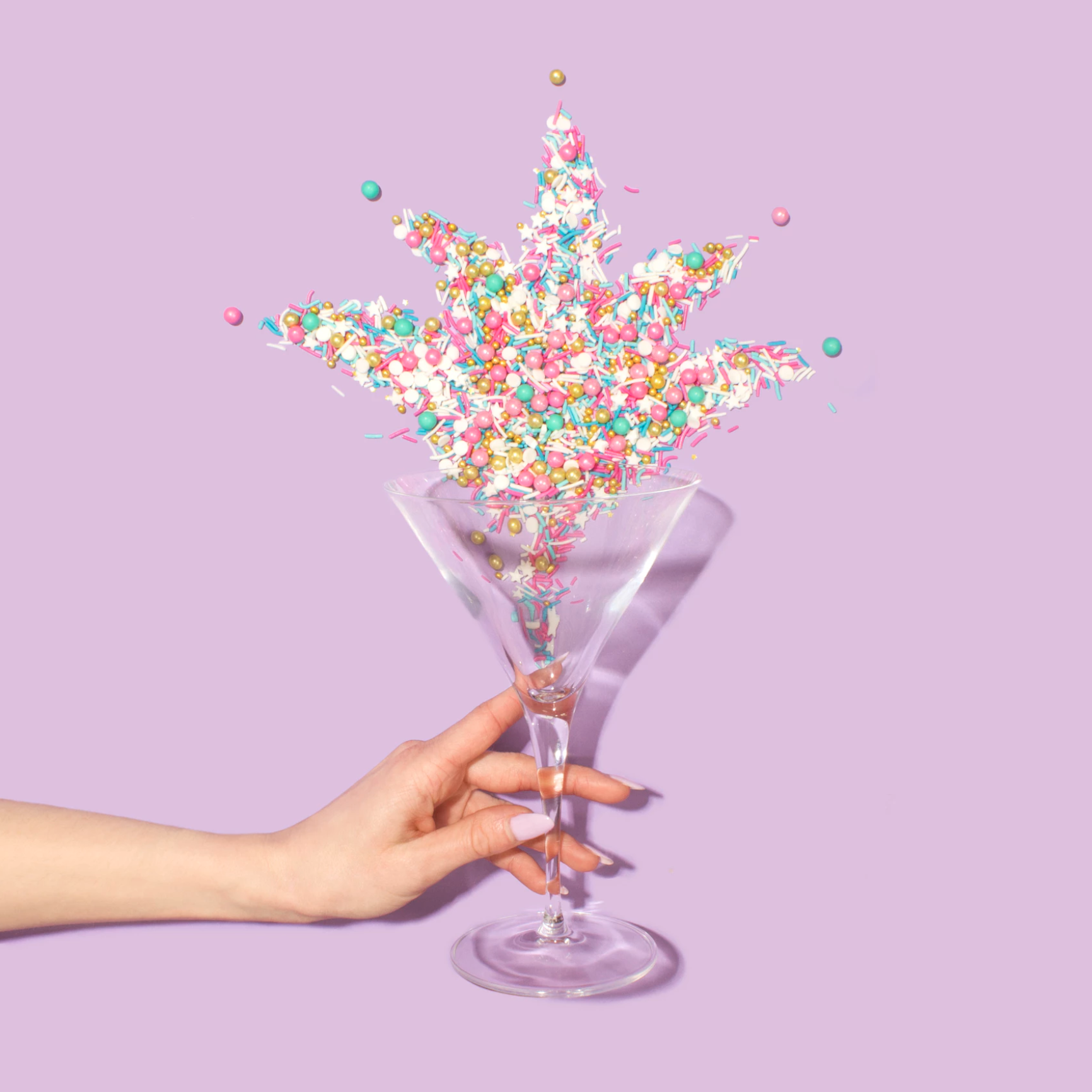 3 glasses of milk with a donut on the straw